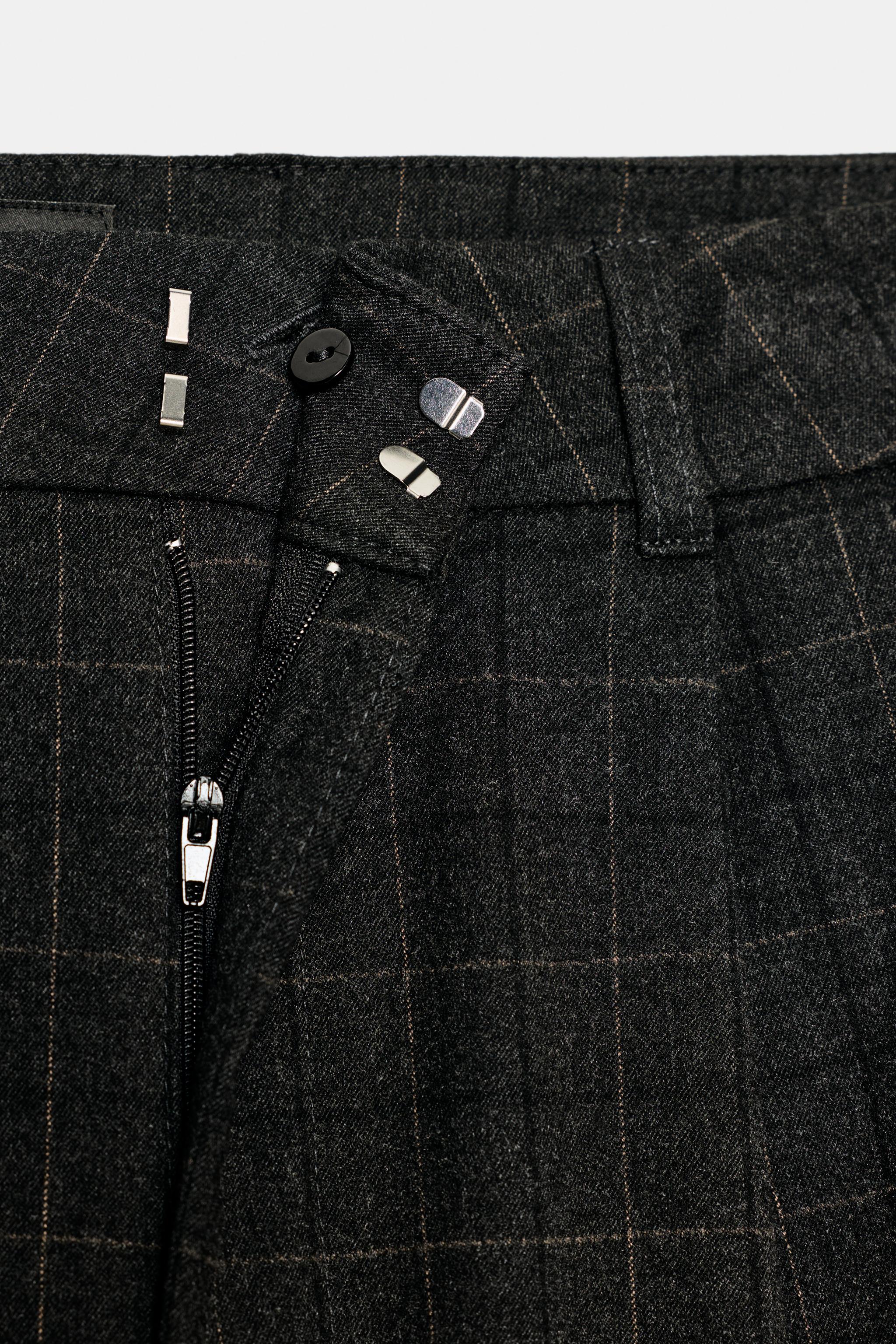 LONG PLAID PLEATED SHORTS